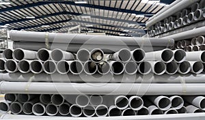 Stack of PVC Pipes inside a factory.