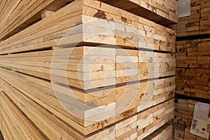 Stack of raw wood, Lumber warehouse storage wooden. Timber goods storehouse. wood import-export industry