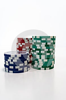 Stack of realistic empty chips for casino on white background