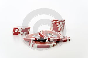 Stack of realistic red chips for casino on white background