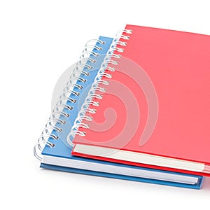 Stack of red and blue color notebooks.