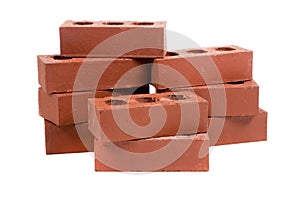 Stack of red bricks on white