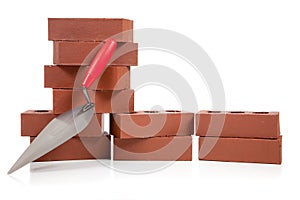 Stack of red bricks on white