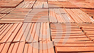 Stack of red clay bricks