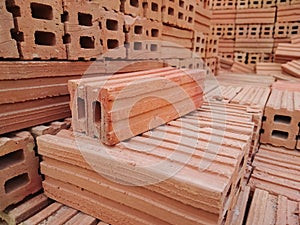 Stack of red clay bricks