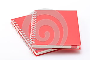 Stack of red color notebooks.