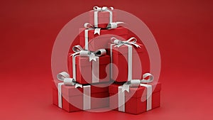 Stack of red gift boxes with white ribbons