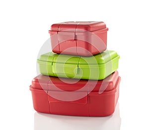 Stack of red and green lunchboxes