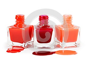 Stack of red nail polish isolated on white background