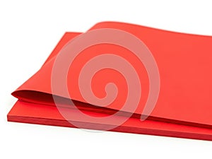 Stack of red paper sheets isolated on white background