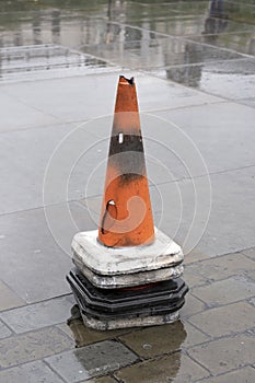 A stack of red plastic road traffic warning cone