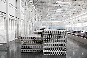 Stack of reinforced concrete slabs in a factory workshop