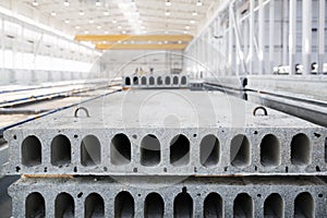 Stack of reinforced concrete slabs in a factory workshop