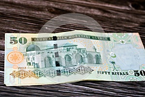 Stack of the reverse side of Saudi Arabia 50 SAR fifty Saudi riyals cash money banknote with the photo of Al Aqsa Mosque photo