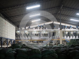 Stack of rice bran bag in the rice milling plant. Agricultural product processing plant. Modern rice miller.