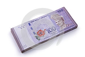 Stack of 100 Ringgit Malaysia on white photo