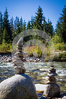 Stack of rocks at the bank of mountain river