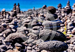 Stack of rocks on a blurry background in the Canary Islands, Spain - business stability concept