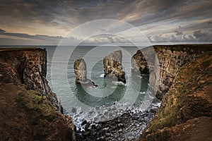 Stack rocks photographed at sunrise on dramatic coastline of Pembrokeshire ,South Wales,UK