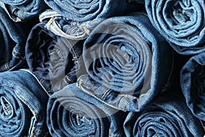 Stack rolled jeans texture on whole background
