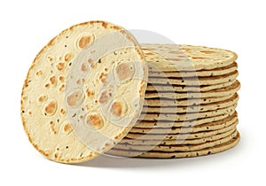 Stack of round flatbreads isolated on white background