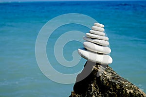 Stack of round smooth stones on a seashore. Balance peace silence concept