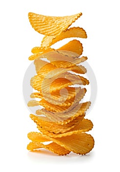 Stack of Ruffled Potato Chips on White Background ridged