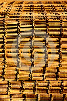 Stack of rusty reinforcing mesh.