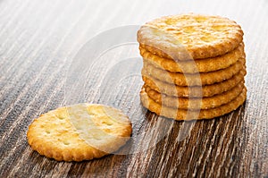 Stack of salted crackers on wooden table