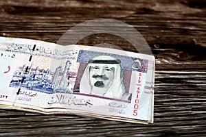 Stack of Saudi Arabia 5 SAR five Saudi riyals cash money banknote with the photo of king Abdullah Bin AbdulAziz Al Saud