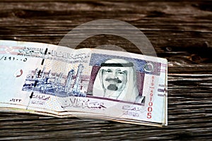 Stack of Saudi Arabia 5 SAR five Saudi riyals cash money banknote with the photo of king Abdullah Bin AbdulAziz Al Saud