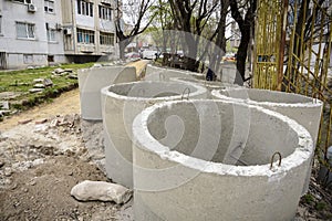 Stack of Sewer concrete pipes in a construction site.