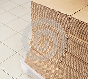 A stack of sheets of industrial packaging board. Cardboard Sheets for Boxes, copy space, industrial, carton