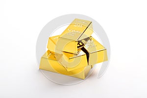 Stack of shiny gold bars on white background