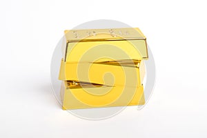 Stack of shiny gold bars on white background