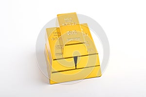 Stack of shiny gold bars on white background