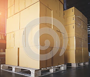Stack of shipment cardboard boxes on wooden pallet. package box, packaging. Manufactiring warehouse cargo delivering goods.