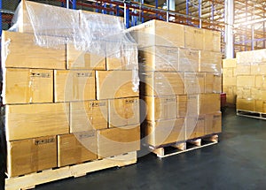 Stack of shipments boxes on wooden pallets. Manufacturing warehouse. Cargo export
