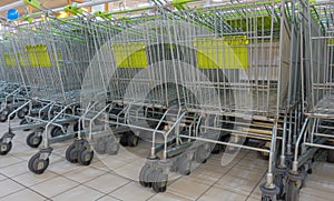 Stack of shopping carts in a supermarket store