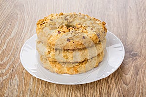 Stack of shortbread rings in white plate on table