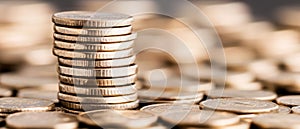 Stack of Silver Coins Representing Wealth and Financial Success