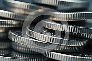 A stack of silver coins are stacked on top of each other, AI