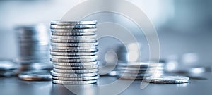 The stack of silver coins symbolizing wealth and financial prosperity. AI generated image
