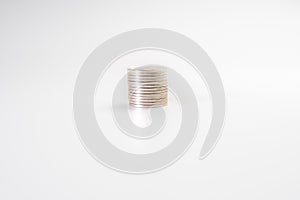 Stack of silver coins  on white background, industry