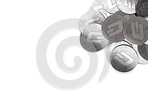 Stack of silver Dash coins in top-right corner isolated on white and copy space for your text.