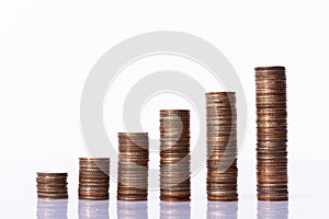 Stack of six coin column as money saving investment or wealth grow and get profit from time. Economy success make money earning as