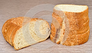 Stack of sliced homemade white bread on the table