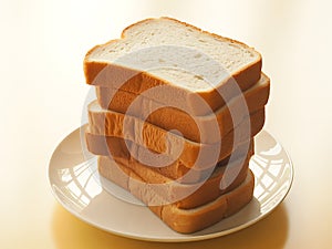 Stack of sliced white bread on a white plate