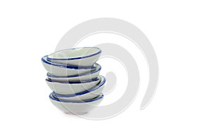 Stack of small bowls on white background