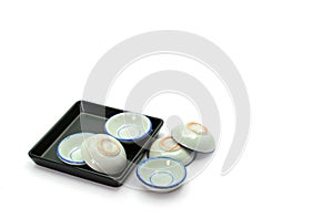 Stack of small bowls on white background